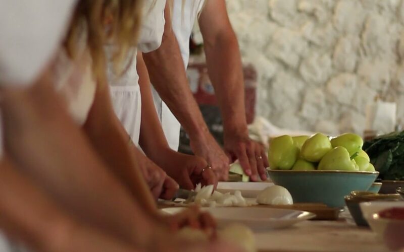 Guests chopping fresh vegetables during the Full Bosnian Feast cooking class