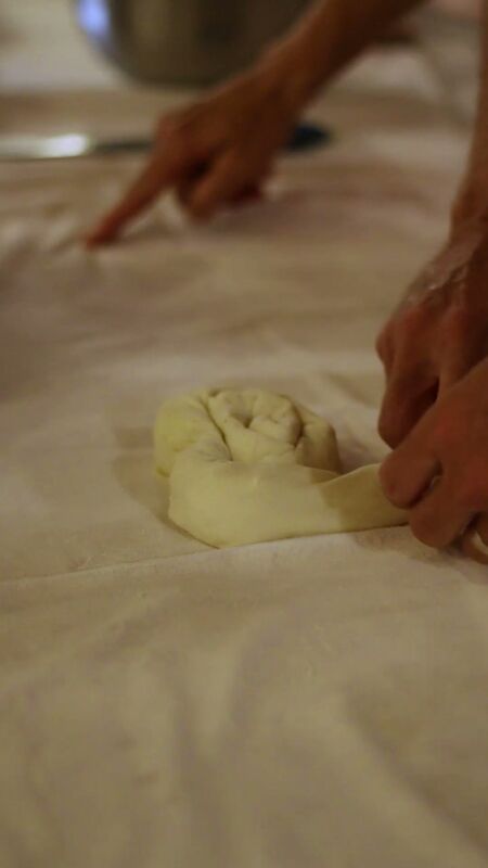Rolling burek into spiral shape